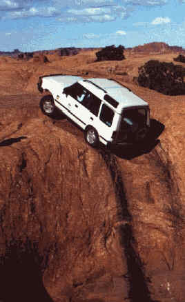 This picture isn't computer enhanced, and the Discovery in question did make it to the top. Take a look at the front shocks for conformation of how steep the hill is.