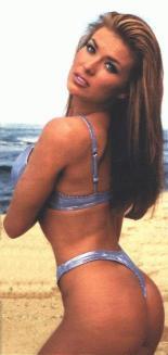 Carman Electra doing her beach workout. "And squeeze and lift and..."